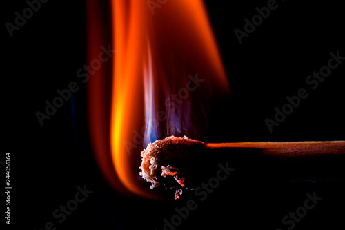 Close up of burning matchstick