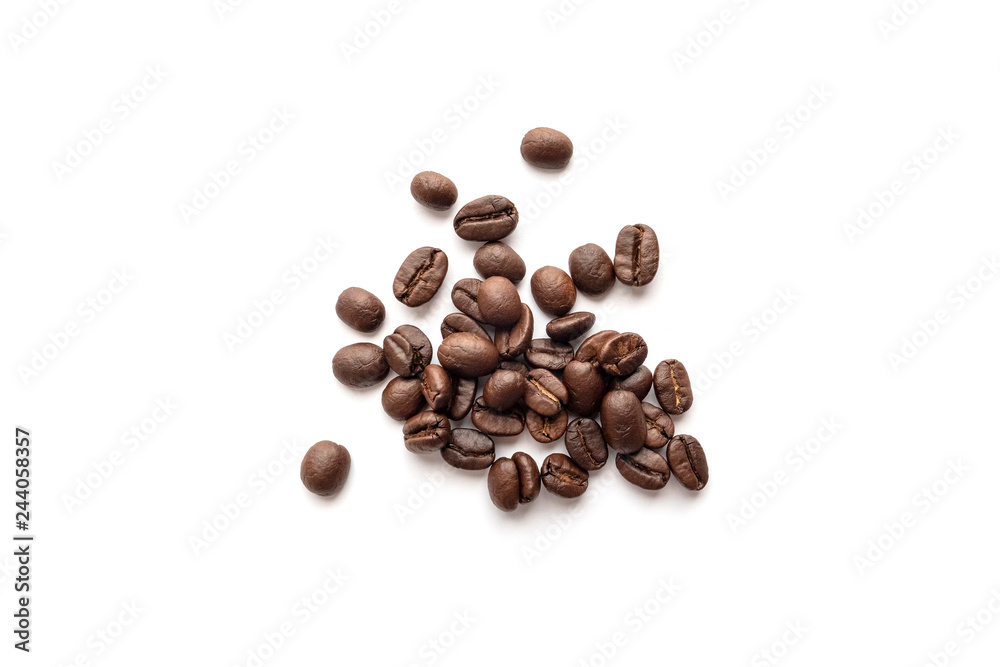 Roasted coffee beans isolated on white background. Close-up. Roasted coffee beans isolated on white background. Close-up.