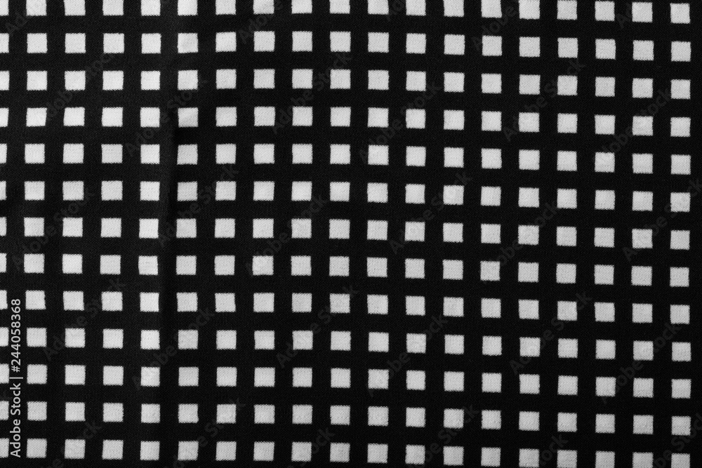 Fragment of black and white fabric. Plaid cotton fabric background Fragment of black and white fabric. Plaid cotton fabric background
