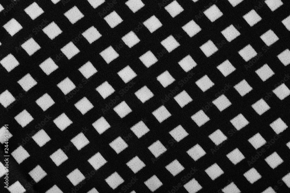 Fragment of black and white fabric. Plaid cotton fabric background Fragment of black and white fabric. Plaid cotton fabric background