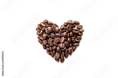 Heart shape of roasted coffee beans on white background.
