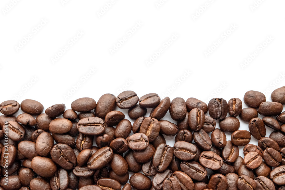 Roasted coffee beans on white background. Close-up. Roasted coffee beans on white background. Close-up.