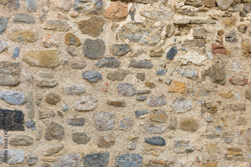 surface of ancient wall of natural stone