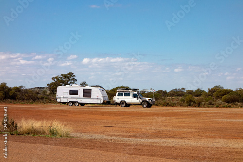 Off road car with air intakes and a white caravan trailer in Western Australia
