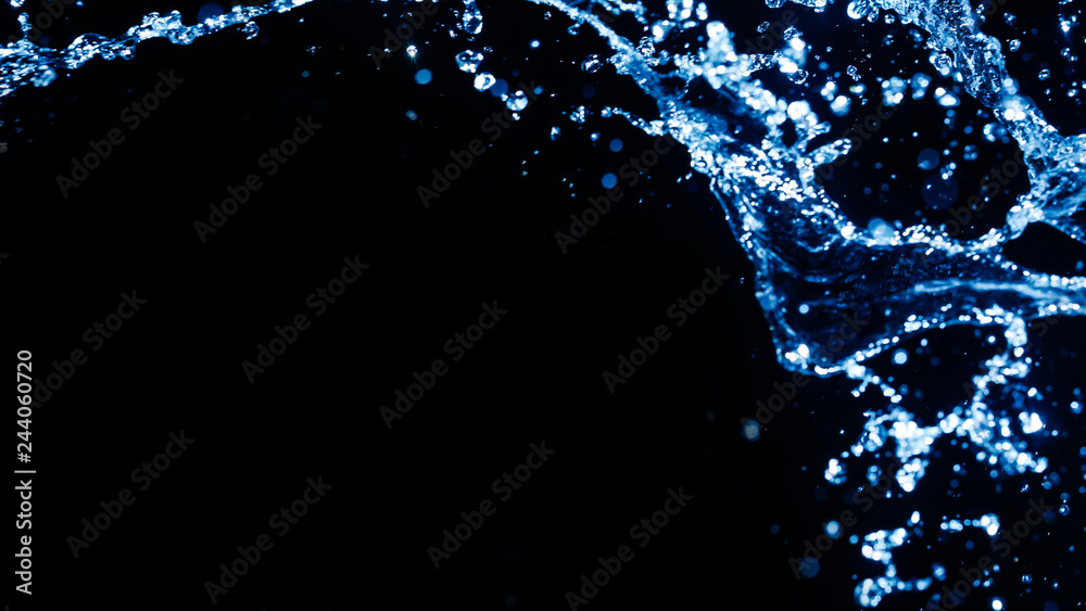 Obraz premium blue water splash on dark background for abstract water concept