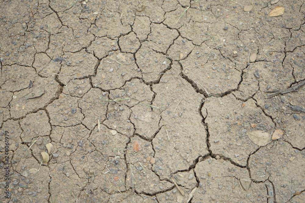 top view arid soil on the ground is dried and broken. top view arid soil on the ground is dried and broken.