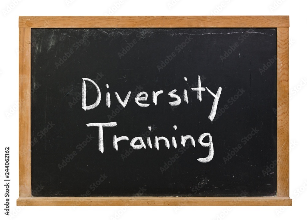 Diversity training written in white chalk on a black chalkboard isolated on white Diversity training written in white chalk on a black chalkboard isolated on white
