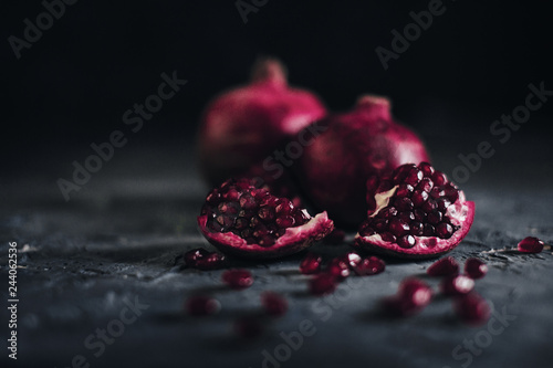 Pomegranate fruit on blue background photo