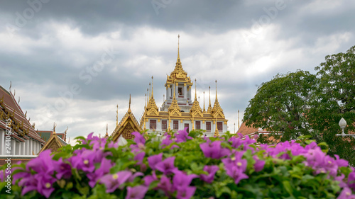 Loha Prasat , The metallic castle covered with gold leaf at of Wat Ratchanadda Temple in Bangkok, Thailand. photo