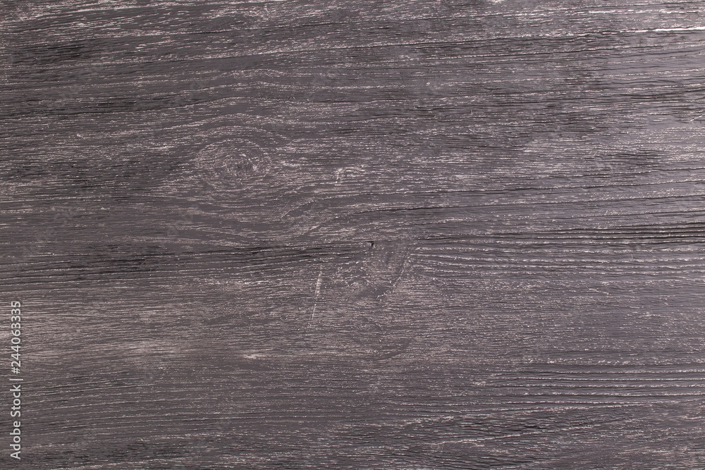 Obraz premium Texture of old dark wooden table in the rays of light