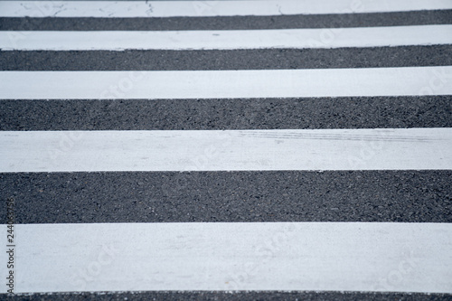 white line paint pattern on asphalt crosswalk, Japan.