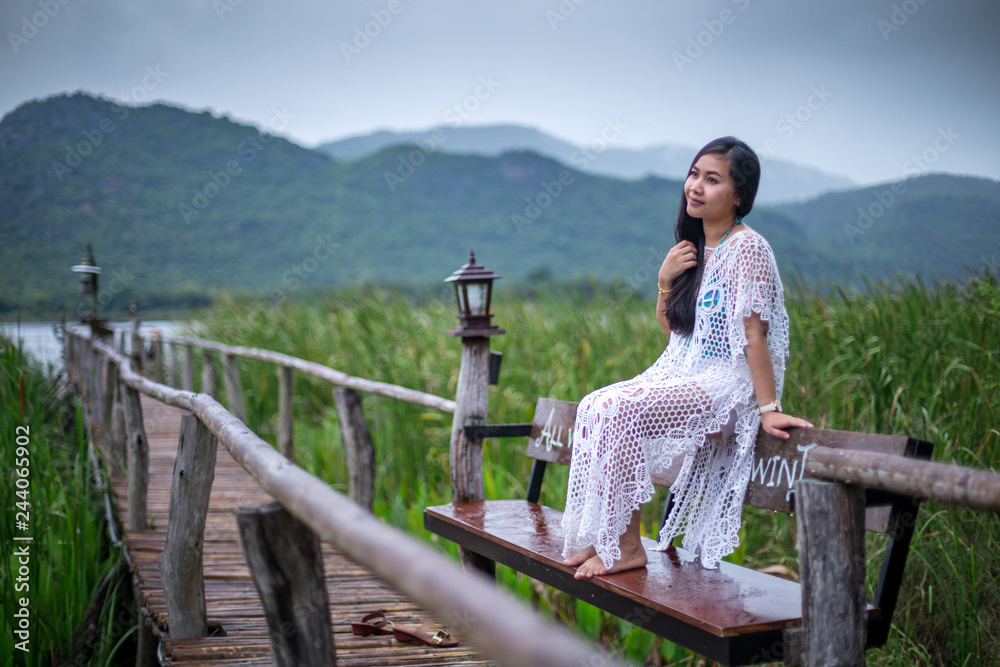 Woman sitting on a pier