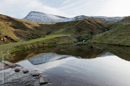 lake with mountains reflected (llyn y fan fach, brecon beacons national park)