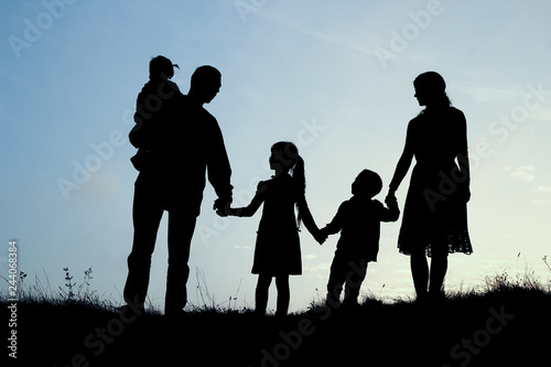 silhouette of a happy family with children