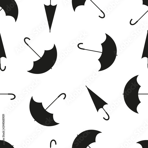Seamless pattern with umbrellas in different positions, on white background. Black and white vector illustration.