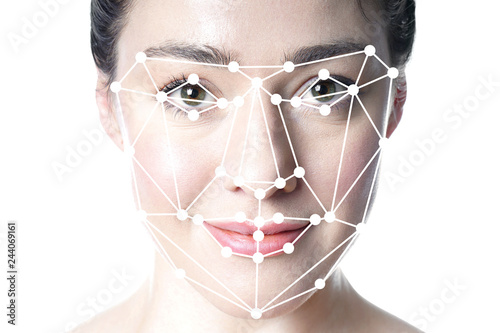 face detection or facial recognition grid overlay on face of young beautiful woman - artificial intelligence or identity or technology concept photo