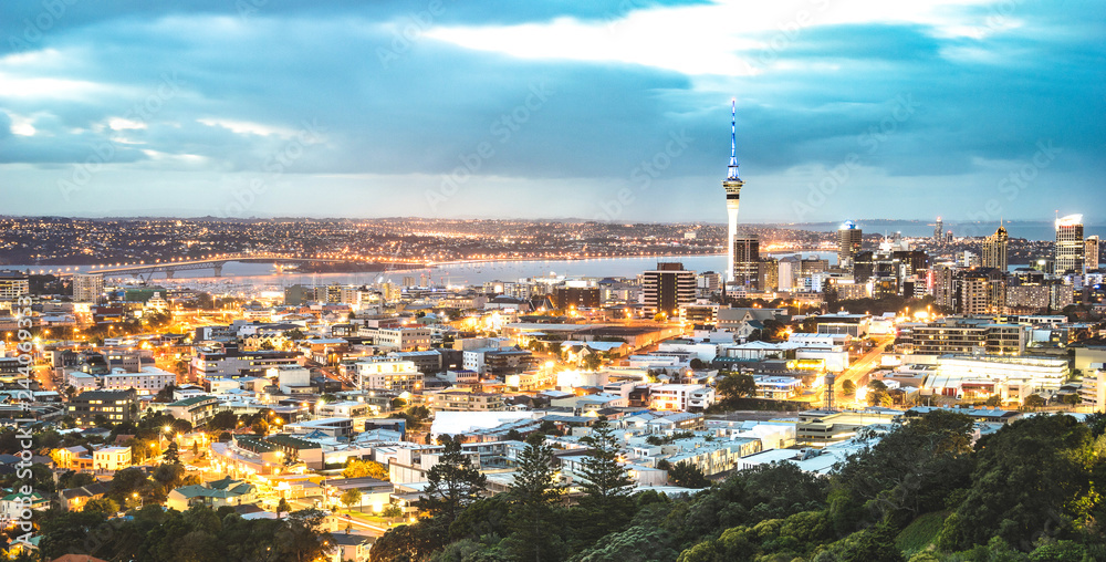 Auckland skyline from Mount Eden after sunset during blue hour - New Zealand modern city with spectacular nightscape panorama -  Enhanced filter on night lights.