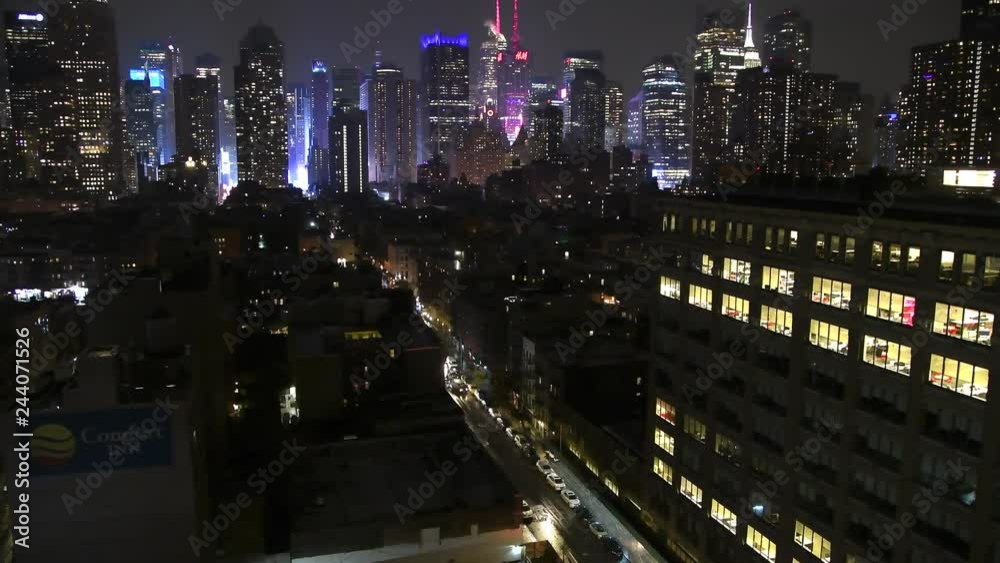 NEW YORK CITY - DECEMBER 3, 2018: Midtown Skyscrapers, aerial view at night. New York attracts 50 million people annually NEW YORK CITY - DECEMBER 3, 2018: Midtown Skyscrapers, aerial view at night. New York attracts 50 million people annually