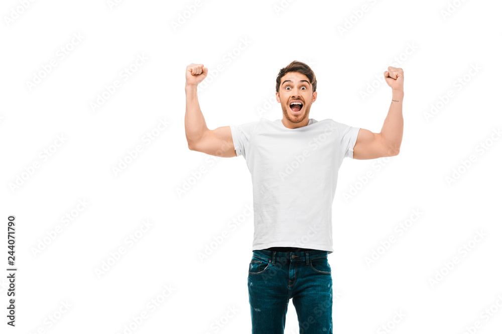 excited young man showing muscles and smiling at camera isolated on white excited young man showing muscles and smiling at camera isolated on white