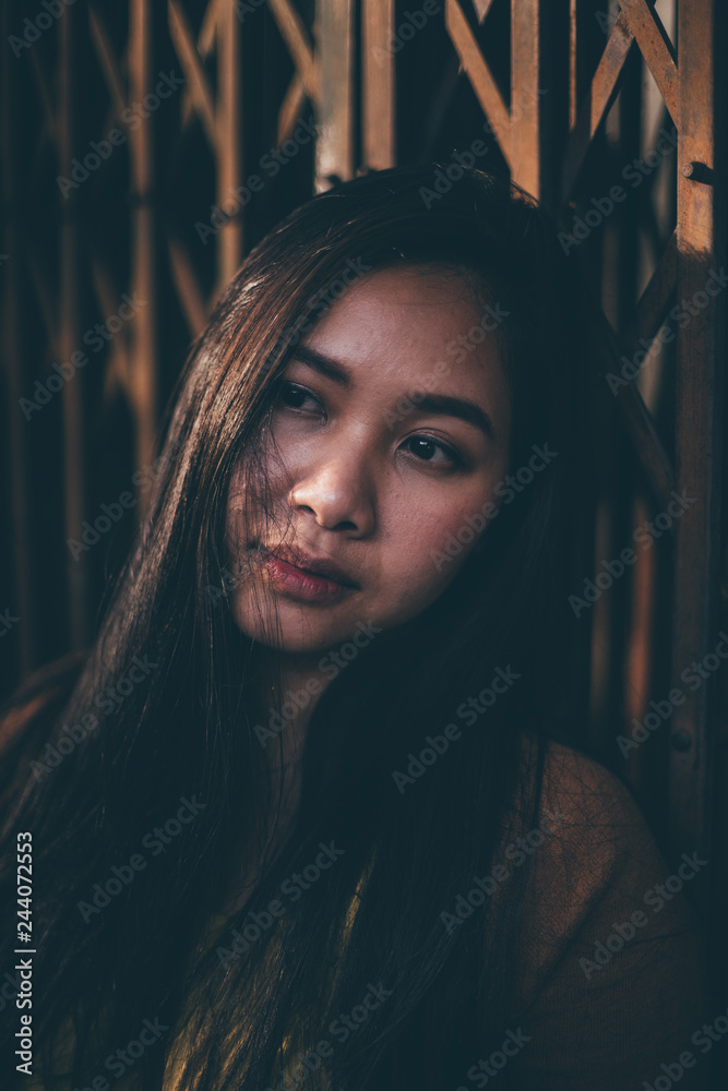 Outdoor portrait of a sad asian girl Outdoor portrait of a sad asian girl