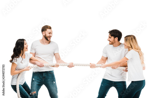 happy young couples pulling rope and playing tug of war isolated on white