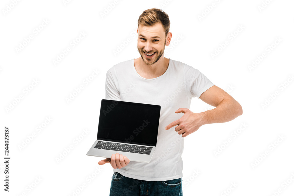 happy young man pointing with finger at laptop with blank screen isolated on white happy young man pointing with finger at laptop with blank screen isolated on white