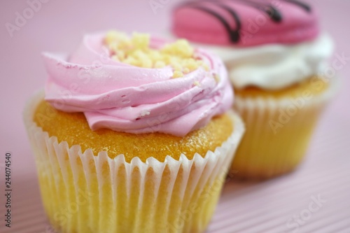 Delicious cakes on wooden background.Sweet dessert for coffee. photo