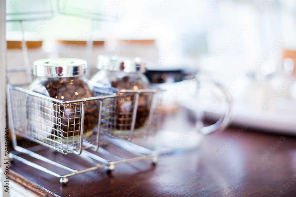 coffee bean and tea with sugar in a glass jar on wooden table coffee bean and tea with sugar in a glass jar on wooden table