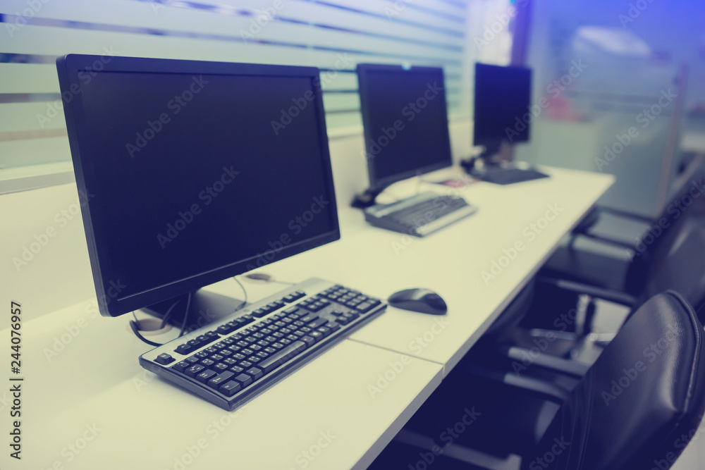 composite image of computer in office or training room composite image of computer in office or training room