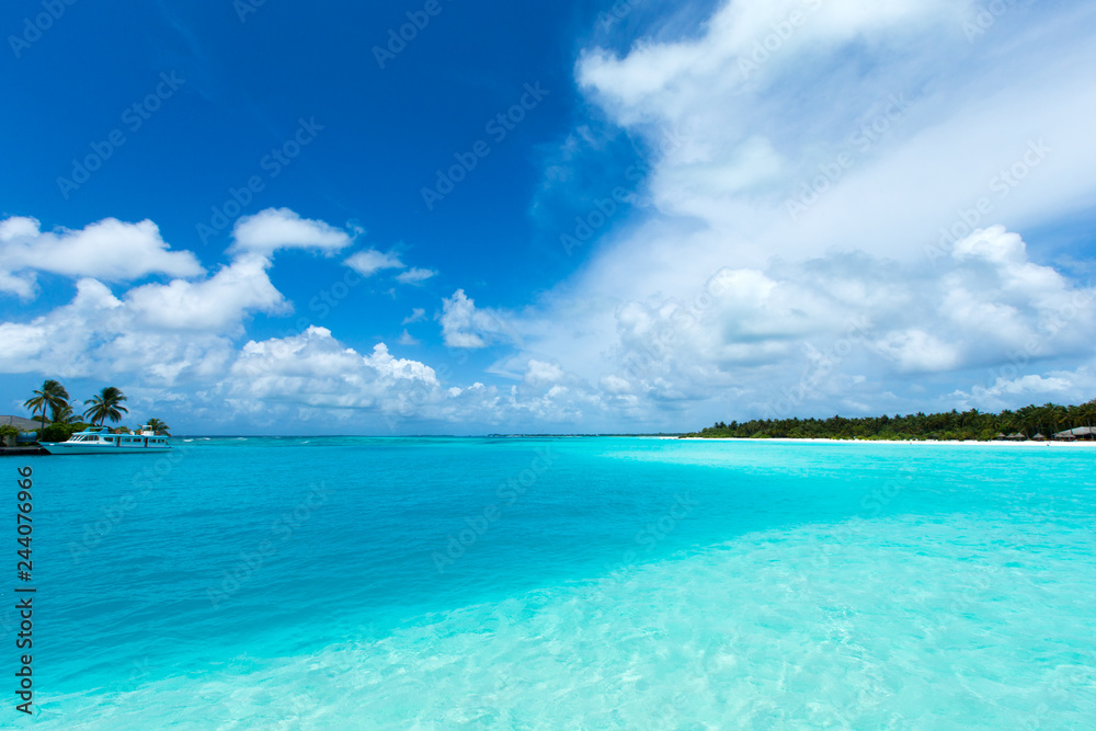tropical Maldives island with white sandy beach and sea tropical Maldives island with white sandy beach and sea