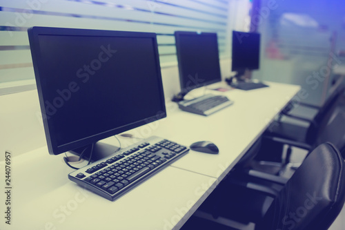 composite image of computer in office or training room