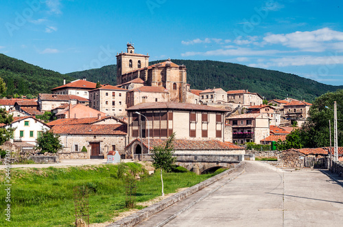 Vinuesa with its Romanesque church on a sunny day. It is a town in the province of Soria in Spain. photo