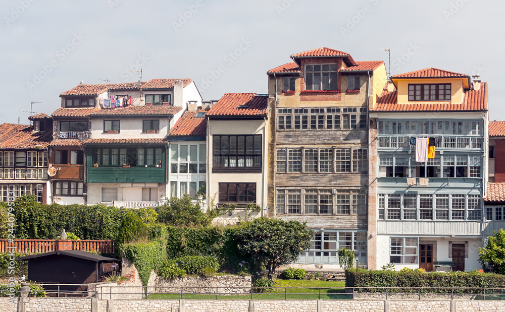 Facades of buildings in Llanes, Asturias north of Spain on a sunny day.