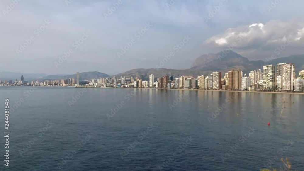 4k Time-Lapse overlooking the Beautiful Playa Levante beach in Benidorm a seaside resort in Spain Alicante, showing hotels, buildings, the tide going in and out and people on the beach. 4k Time-Lapse overlooking the Beautiful Playa Levante beach in Benidorm a seaside resort in Spain Alicante, showing hotels, buildings, the tide going in and out and people on the beach.