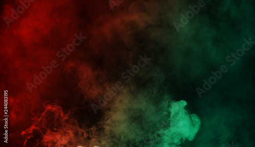 Abstract red vs green smoke steam moves on a black background . The concept of aromatherapy