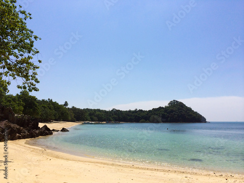 Wild tropical sandy beach with rocks © lookproduction
