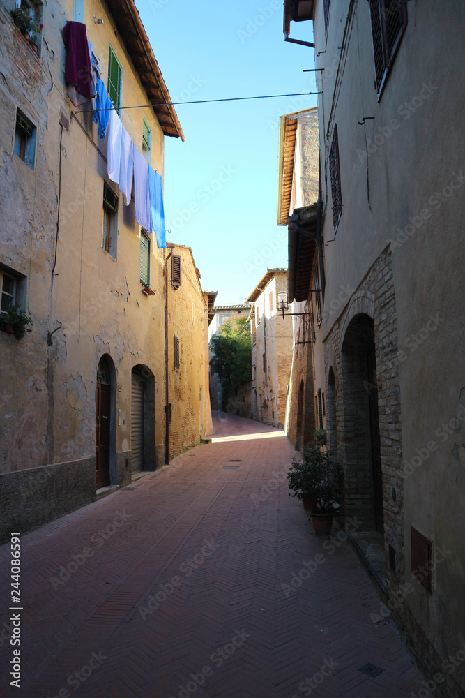 Cosy street in medieval town San Gimignano, Tuscany, Italy