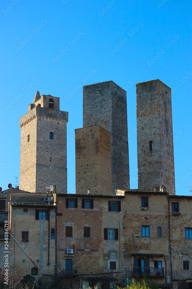 Medieval towers of tuscany town San Gimignano panoramic view at sunny winter day, Italy