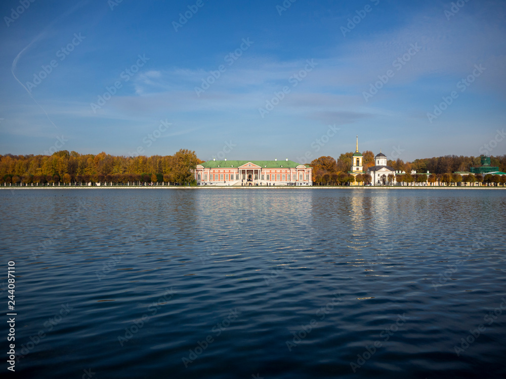 manor house view from other side of lake