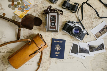 vintage map, film cameras, antique binoculars, passport and photo prints