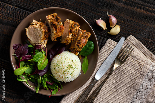 Cuadro en lienzo Roasted pork tenderloin served with boiled rice and mix of salad.