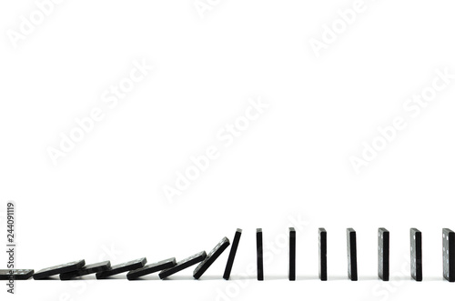 Black Domino on white background, drop, Domino effect, Hobbies and entertainment. photo