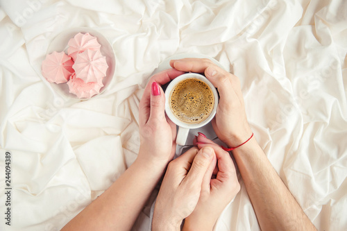 Coffee in bed. Selective focus. Love drink. photo