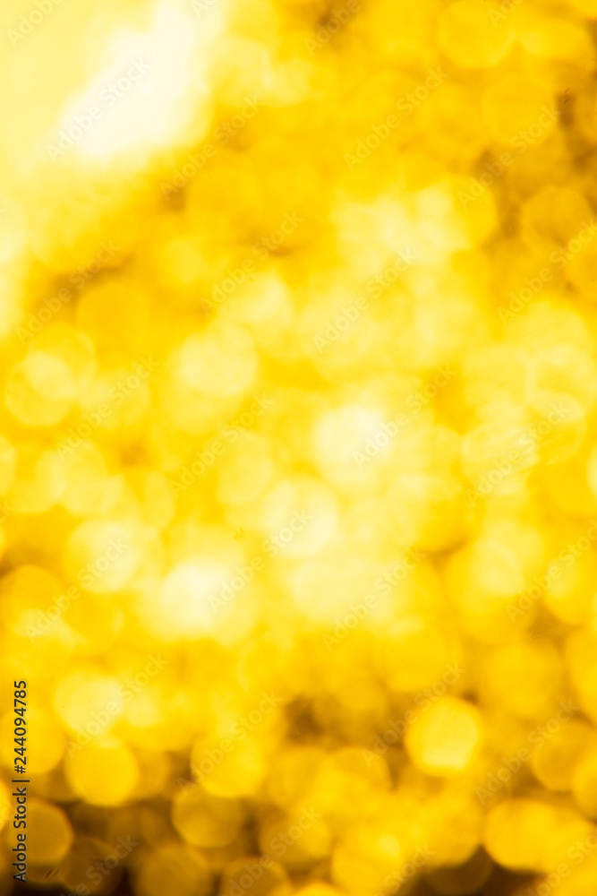 Golden glitter festive background with bokeh lights. Celebration concept for New Year, Christmas Holidays. Golden glitter festive background with bokeh lights. Celebration concept for New Year, Christmas Holidays.