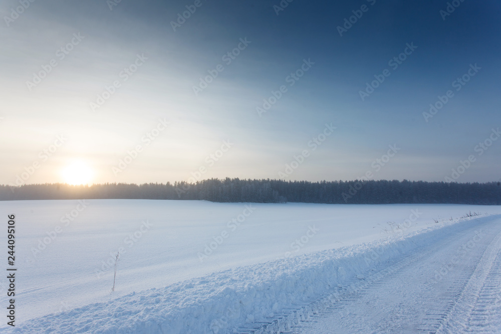 Winter landscape at sunrise with road Winter landscape at sunrise with road