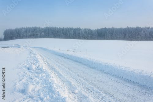 Winter landscape at sunrise with road