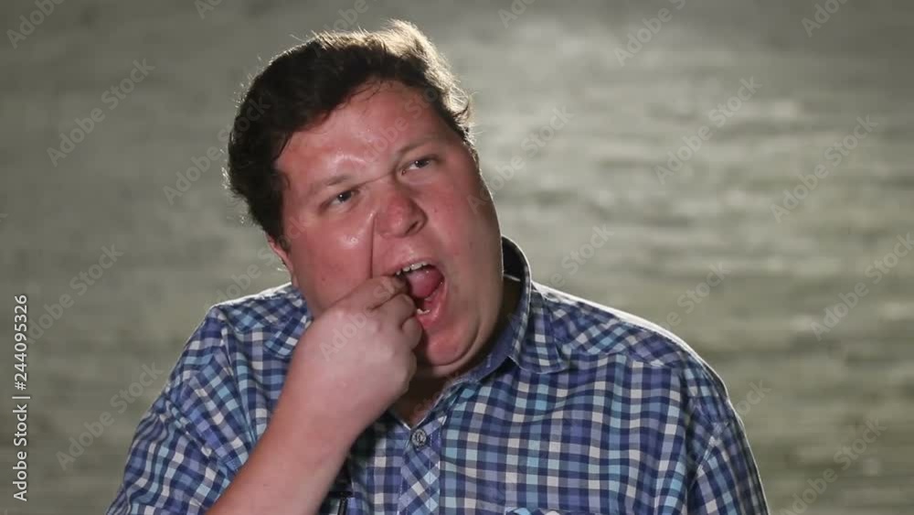 Man has something stuck in the tooth in the evening Man has something stuck in the tooth in the evening