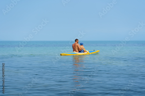 father and son in kayak © avtk