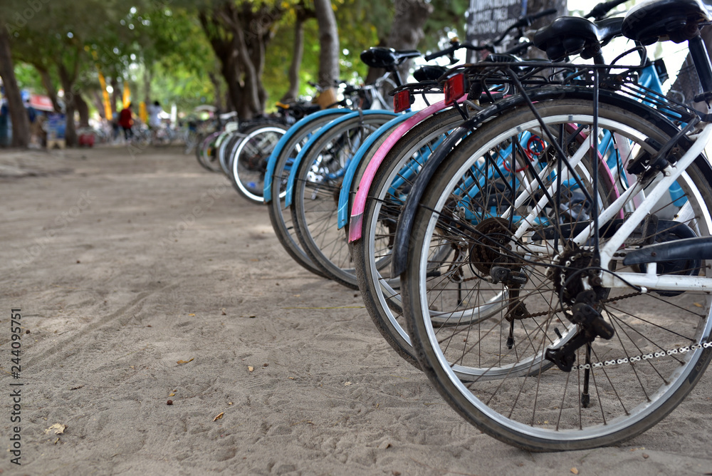 Rental bicycles in a row at a city bike rental in Gili Trawangan Island, Lombok, Indonesia