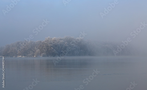 Winter landscape. Misty river.